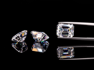 Close-up showing the difference in brilliance and fire between a moissanite and a diamond gemstone.