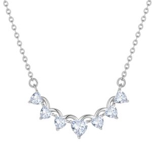 Silver necklace featuring multiple diamonds arranged in a gentle arc, enhancing a V-neck neckline