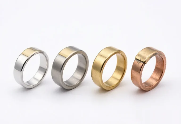 Comparison of base metals for gold plated jewelry including 925 sterling silver, stainless steel, brass, and copper