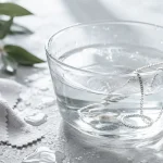 Sterling silver jewelry submerged in water for a guide about whether silver tarnishes in water.